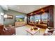 Cozy living room featuring built-in shelves, entertainment center and window seat with scenic views at 4502 Echo Cliff Ln, Larkspur, CO 80118