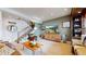 Comfortable living room with a staircase, a wooden cabinet, and a cozy armchair at 4502 Echo Cliff Ln, Larkspur, CO 80118