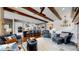 Spacious living room featuring an open layout with beamed ceilings and elegant decor at 4502 Echo Cliff Ln, Larkspur, CO 80118
