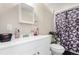 Bathroom with a white vanity, mirror, and a shower featuring a skull shower curtain at 119 Yakima St, Lochbuie, CO 80603