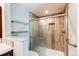 Modern bathroom featuring tiled shower with glass door and built-in niche at 5250 S Huron Way # 10-207, Littleton, CO 80120
