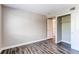 Empty bedroom features wood-look floors and a closet with sliding doors at 5250 S Huron Way # 10-207, Littleton, CO 80120
