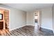 Airy bedroom showcasing elegant wood-look flooring and an en-suite bathroom with a modern vanity at 5250 S Huron Way # 10-207, Littleton, CO 80120