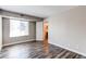 Bright bedroom with stylish flooring and an adjoining bathroom offers convenience and modern appeal at 5250 S Huron Way # 10-207, Littleton, CO 80120
