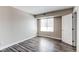 Well-lit bedroom with a large window, modern flooring, and a neutral color scheme creates a calming atmosphere at 5250 S Huron Way # 10-207, Littleton, CO 80120