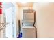 Efficient laundry space with stacked washer and dryer, maximizing functionality in a compact area at 5250 S Huron Way # 10-207, Littleton, CO 80120