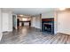 Inviting living space with fireplace, modern flooring, and easy access to the kitchen at 5250 S Huron Way # 10-207, Littleton, CO 80120