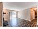 Bright living room features modern fireplace, sliding glass doors to balcony, and updated floors at 5250 S Huron Way # 10-207, Littleton, CO 80120
