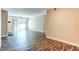 Spacious living area boasts sleek flooring, neutral paint, and a sliding door to a balcony at 5250 S Huron Way # 10-207, Littleton, CO 80120
