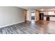 Open floor plan reveals a modern kitchen, neutral color palette, and stylish wood-look flooring at 5250 S Huron Way # 10-207, Littleton, CO 80120