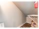 Unique storage area featuring sloped ceilings and a practical wire shelf for organizing belongings efficiently at 5250 S Huron Way # 10-207, Littleton, CO 80120