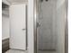 Basement bathroom with a shower stall and glass enclosure at 8932 Neil St, Thornton, CO 80260