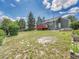 Spacious backyard with a well-maintained lawn, wooden fence, and a charming deck attached to the house at 778 S Fairplay Ct, Aurora, CO 80012