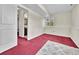 Basement area leading to bathroom with neutral walls and carpet at 778 S Fairplay Ct, Aurora, CO 80012