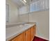 Well-lit bathroom featuring a single sink and vanity at 778 S Fairplay Ct, Aurora, CO 80012