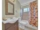Well-lit bathroom showcasing a vanity with sink, toilet, tub, and shower at 778 S Fairplay Ct, Aurora, CO 80012