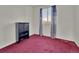 The bedroom features red carpet, white walls, a window with curtains, and a black cabinet at 778 S Fairplay Ct, Aurora, CO 80012