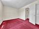 Bright bedroom featuring neutral walls and red carpeting at 778 S Fairplay Ct, Aurora, CO 80012