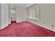 Cozy bedroom with large window offering plenty of natural light and soft carpet at 778 S Fairplay Ct, Aurora, CO 80012