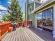 Spacious wooden deck with barbecue and view of yard at 778 S Fairplay Ct, Aurora, CO 80012