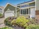 A home featuring an attached garage, beautiful windows, and manicured bushes at 778 S Fairplay Ct, Aurora, CO 80012