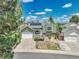 Inviting home featuring solar panels, a well-maintained lawn, and a detached two-car garage in a quiet neighborhood at 778 S Fairplay Ct, Aurora, CO 80012