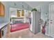 Open concept kitchen with stainless steel refrigerator and view into the living room at 778 S Fairplay Ct, Aurora, CO 80012