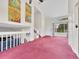 Open living area with lots of natural light, a staircase, and eye-catching wall art at 778 S Fairplay Ct, Aurora, CO 80012