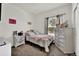 Bright bedroom with soft carpet, light neutral colors, and a cozy feel at 7433 Ellingwood Cir, Frederick, CO 80504