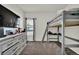 Bedroom featuring gray carpeted floors, neutral walls, and a loft bed at 7433 Ellingwood Cir, Frederick, CO 80504