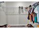 Walk-in closet with ample shelving and hanging space for organized storage at 7433 Ellingwood Cir, Frederick, CO 80504