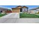 Charming home featuring a two-car garage, well-manicured lawn, and inviting curb appeal at 7433 Ellingwood Cir, Frederick, CO 80504