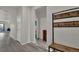 Bright entryway with stylish wood flooring and a coat rack at 7433 Ellingwood Cir, Frederick, CO 80504