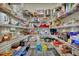 Walk-in pantry with an abundance of shelving, stocked with lots of food and small appliances for organization at 7433 Ellingwood Cir, Frederick, CO 80504