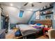 Bedroom with sloped ceiling, featuring shelves, and a window allowing for natural light at 2699 S Xanadu Way # A, Aurora, CO 80014
