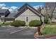 Exterior view of a building with neatly landscaped bushes and assigned parking spaces at 2699 S Xanadu Way # A, Aurora, CO 80014