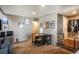 Inviting living room with neutral walls, carpeted floors, and stylish furnishings creating a cozy atmosphere at 2699 S Xanadu Way # A, Aurora, CO 80014