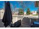 Inviting outdoor patio area with comfortable seating and a pleasant view of the surrounding neighborhood at 2699 S Xanadu Way # A, Aurora, CO 80014