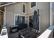 Cozy patio area with a grill, bench, and shade umbrella offering a relaxing outdoor space at 2699 S Xanadu Way # A, Aurora, CO 80014