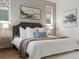 Cozy bedroom with a comfortable king bed, soft linens, and stylish bedside tables at 9378 E 60Th Pl, Denver, CO 80238