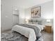 Serene bedroom featuring a well-made bed, soft lighting, and a closet, offering both comfort and convenience at 9378 E 60Th Pl, Denver, CO 80238