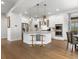 Bright, modern kitchen with a spacious island, stainless steel appliances, and hardwood floors at 9378 E 60Th Pl, Denver, CO 80238
