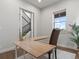 Bright home office with modern desk, comfortable chair, and large window at 9378 E 60Th Pl, Denver, CO 80238