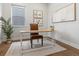 Home office with a sleek desk, comfortable chair, and natural light at 9378 E 60Th Pl, Denver, CO 80238