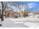 Spacious backyard with patio furniture and snowy lawn at 2222-2224 Hooker St, Denver, CO 80211