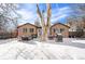 Snowy backyard with patio furniture and grill in winter at 2222-2224 Hooker St, Denver, CO 80211