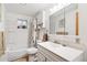 Full bathroom featuring a tub shower combo with a vanity and a neutral color scheme at 2222-2224 Hooker St, Denver, CO 80211