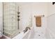 Bathroom features a glass block shower with a built-in tub and bronze hardware at 2222-2224 Hooker St, Denver, CO 80211
