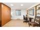 Bright bedroom features a Murphy bed, custom shelving, desk, and hardwood floors at 2222-2224 Hooker St, Denver, CO 80211