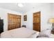 Bedroom with hardwood floors, white walls and natural wood doors at 2222-2224 Hooker St, Denver, CO 80211